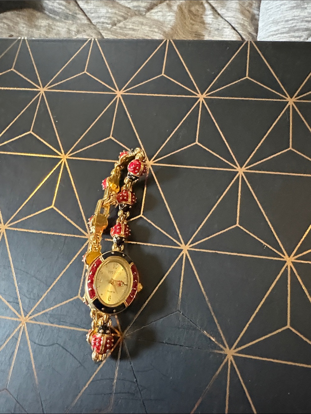 Gold-Tone Women's Bracelet Watch with Red Enamel Accents